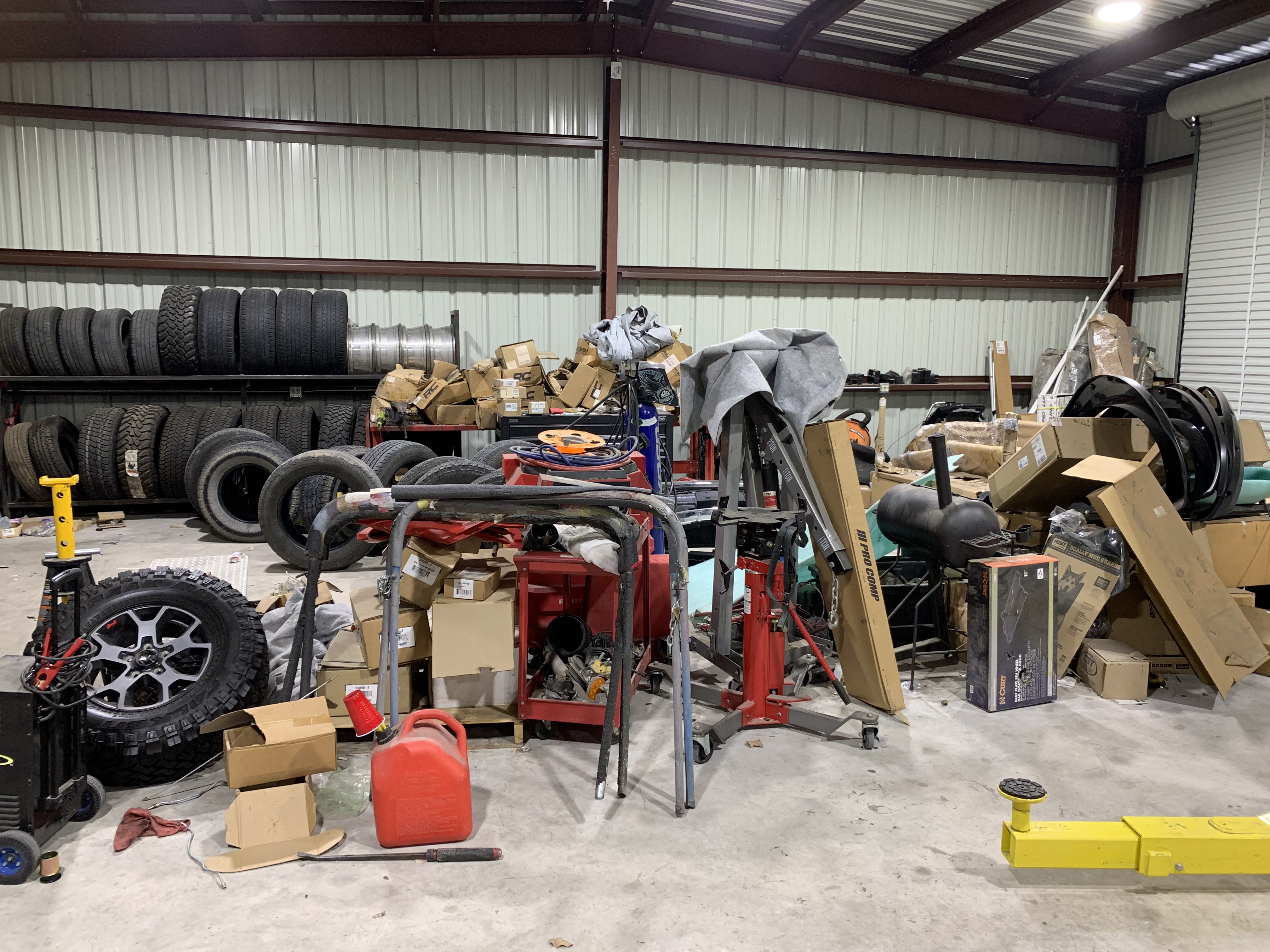 Tire inventory and parts storage at Truck Country Outfitters warehouse in Marble Falls TX