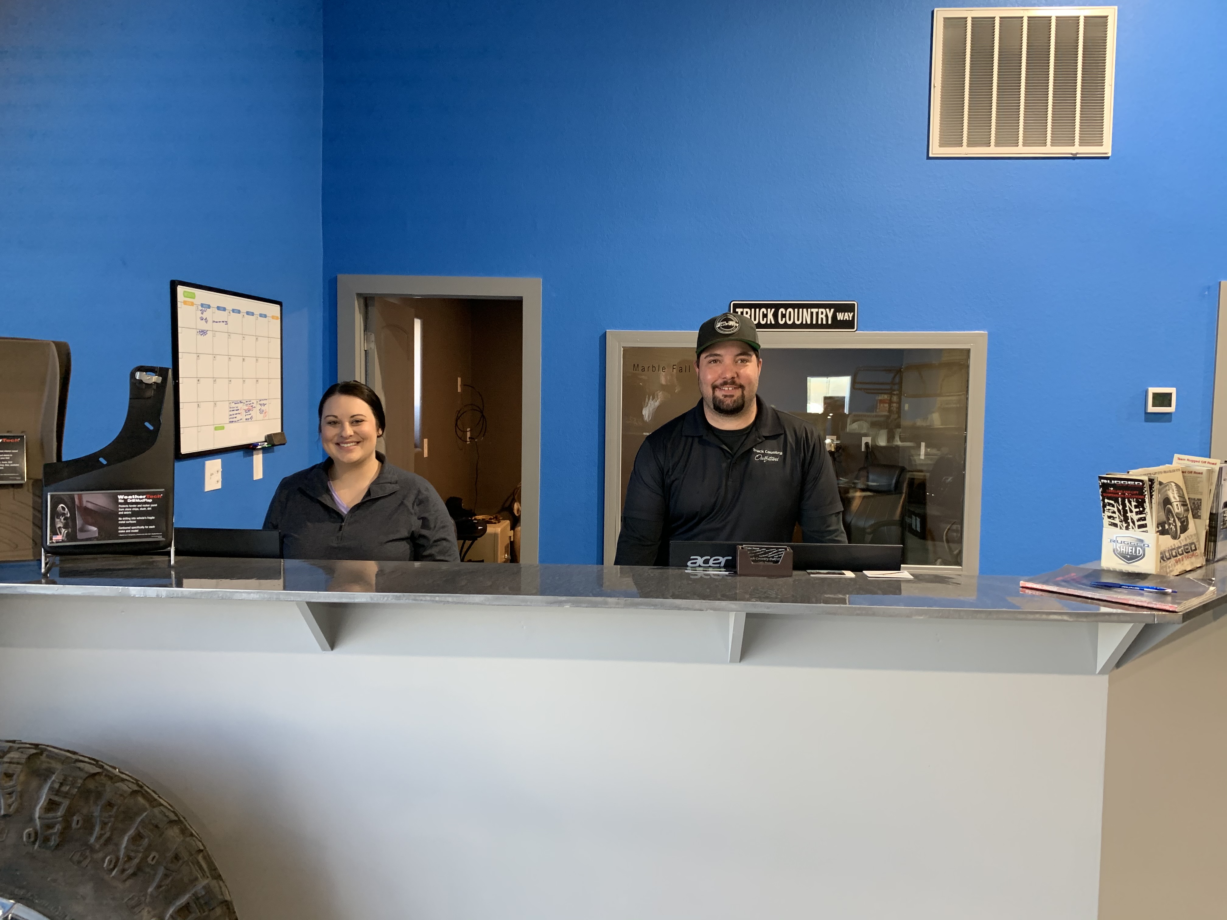 Truck Country Outfitters staff at the service counter in Marble Falls, TX